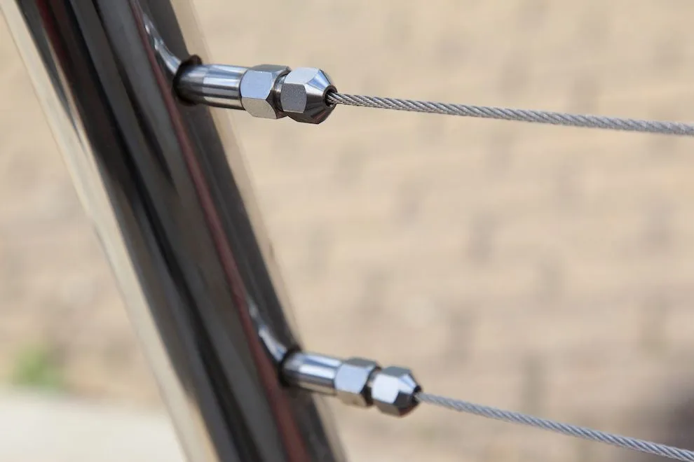 Stainless steel wire tensioners on a balustrade post