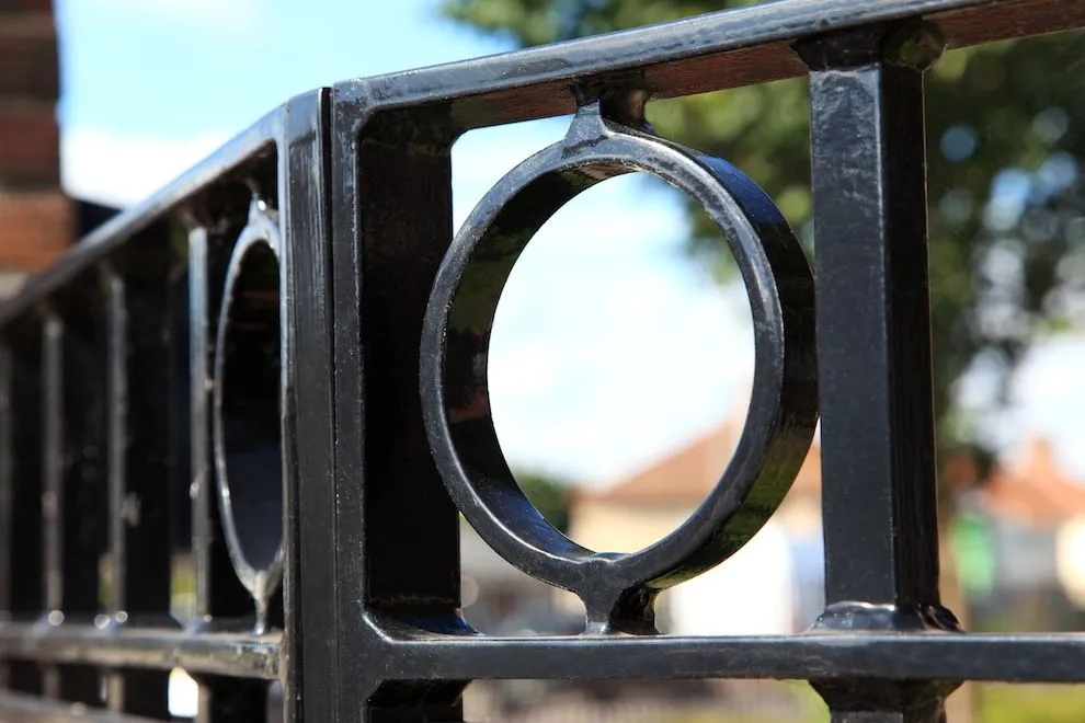 Black steel railing panel with a circular ring detail