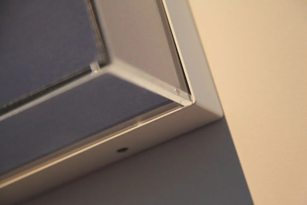 Corner detail of a powder-coated steel display plinth