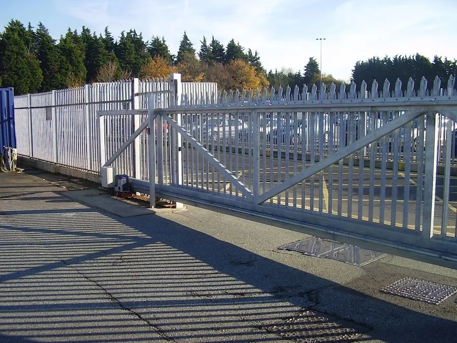 Galvanised steel sliding security gate with palisade fencing