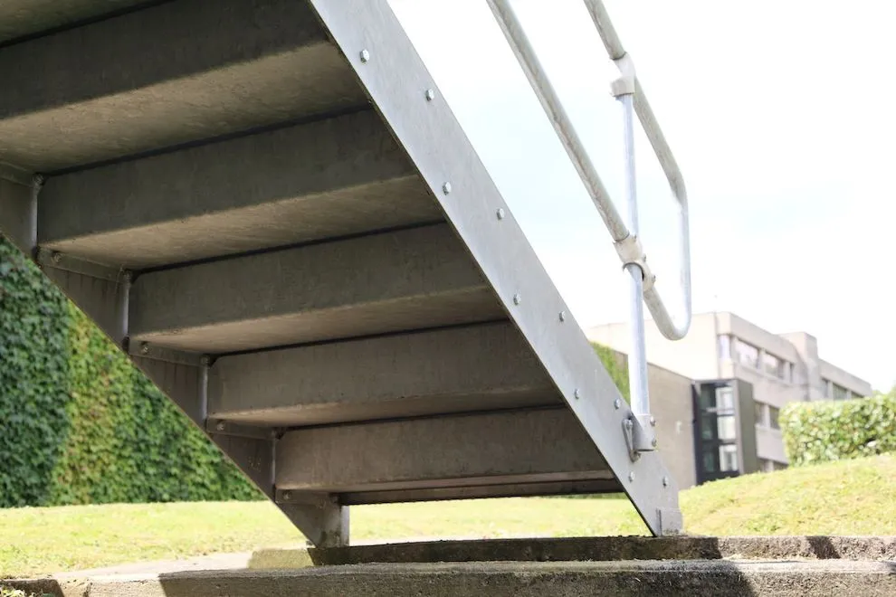 Galvanised steel stair flight seen from below